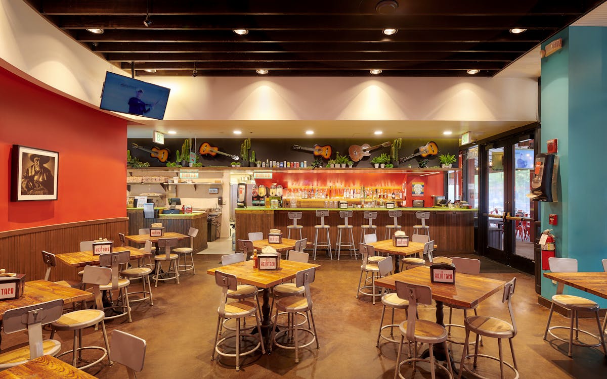 a room filled with furniture and a table in a restaurant